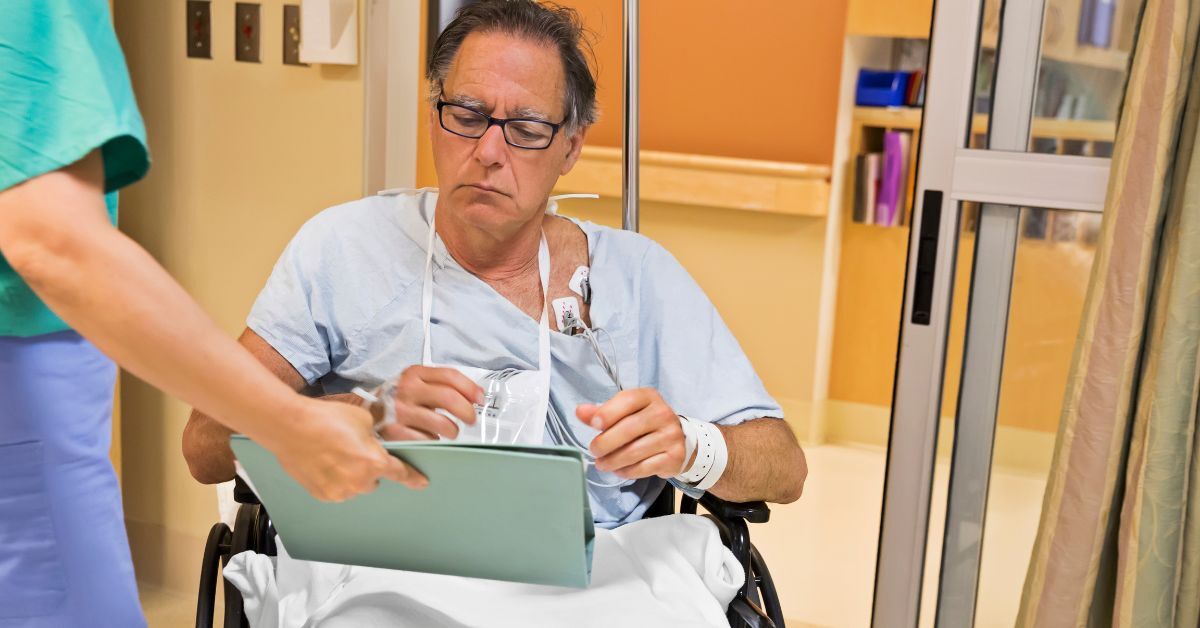 A patient being handed discharge instructions after a hospital visit.